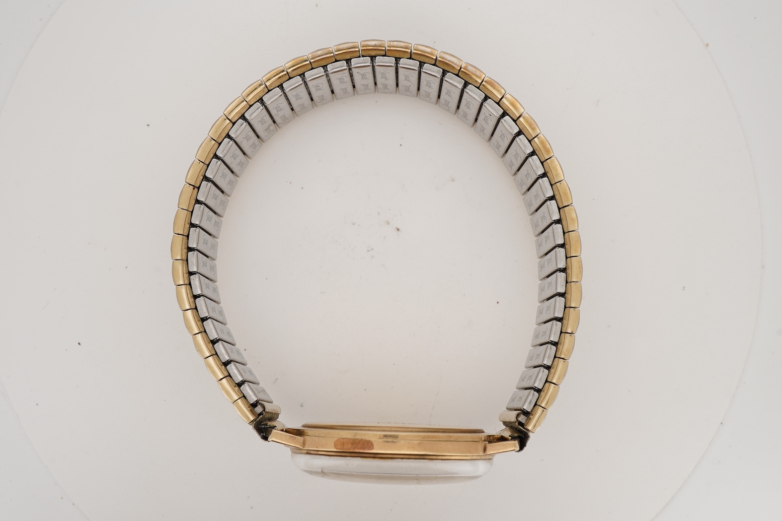 A gentleman's 1970's gold manual wind wrist watch, retailed by Garrard